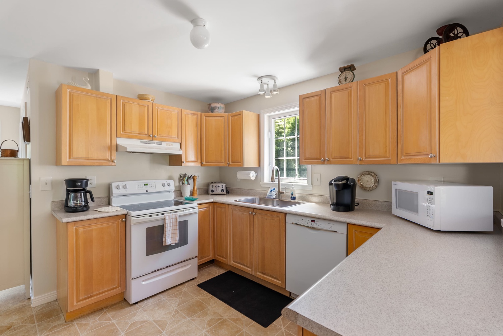 A fully equipped kitchen featuring modern appliances.