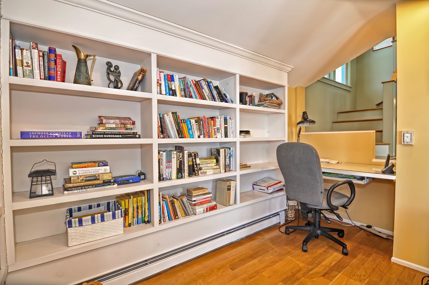 There is a comfortable working nook with desk in the corner.