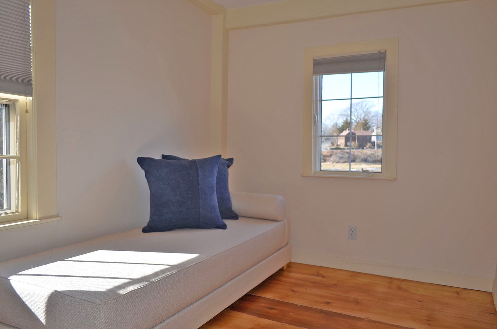 A bright, sunny corner sitting room with lovely water views.
