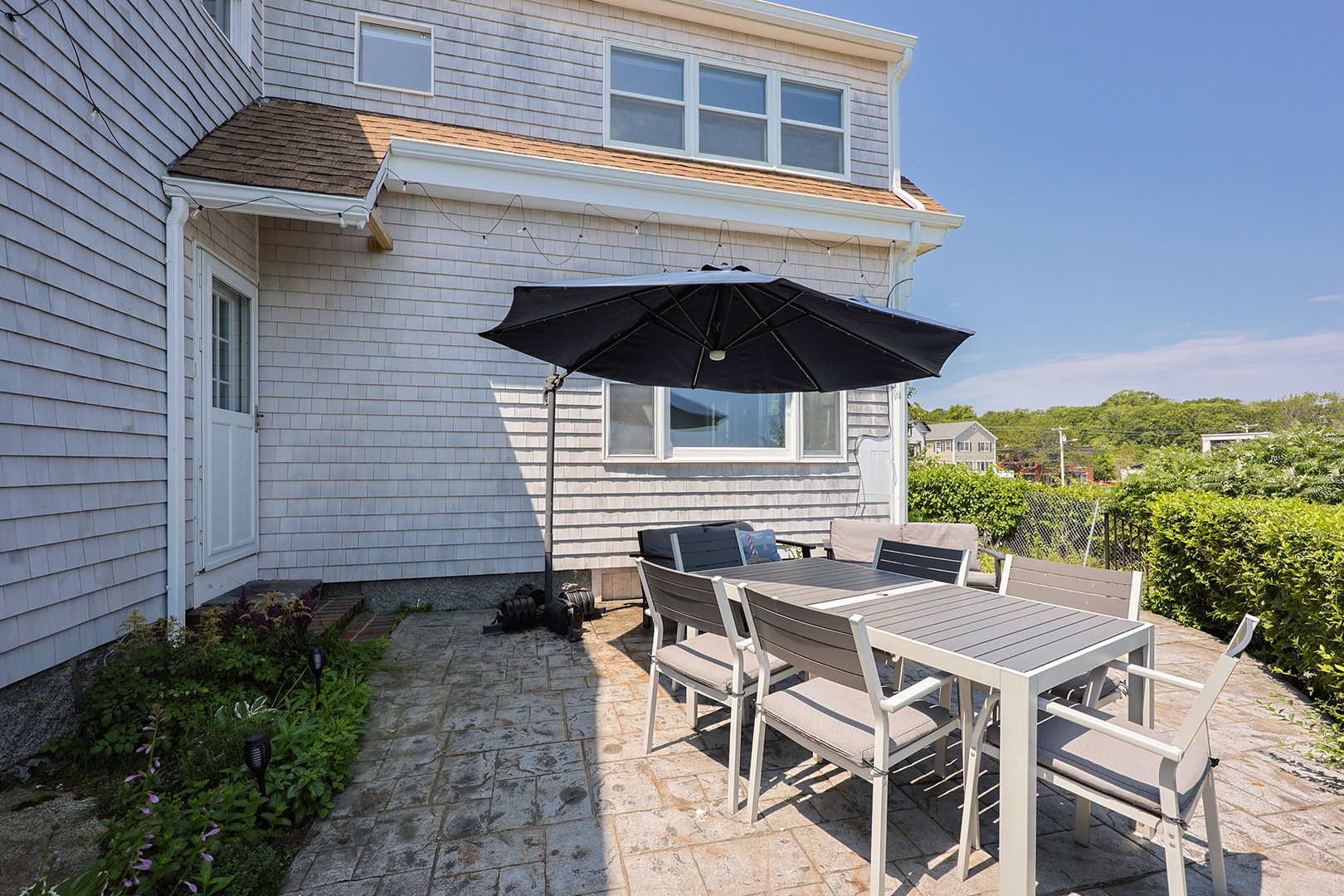 Patio with seating and beautiful waterfront views.