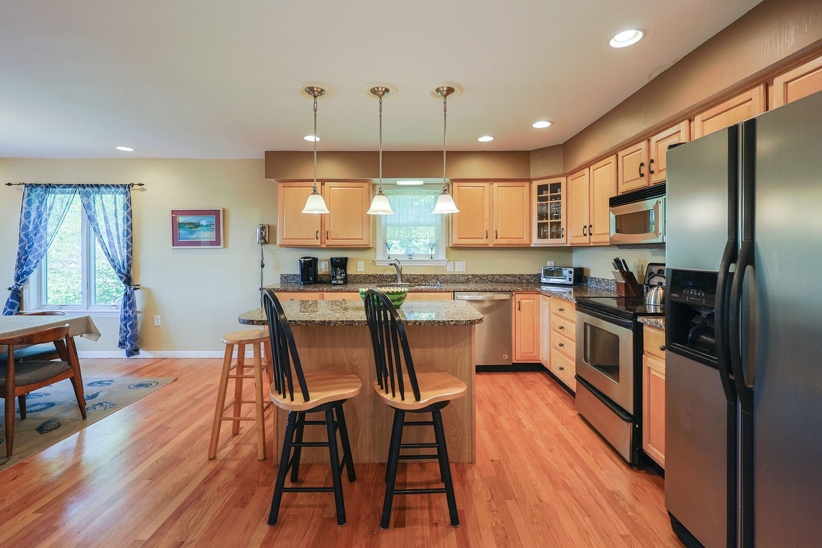 Warm wood cabinets and modern appliances complete the kitchen