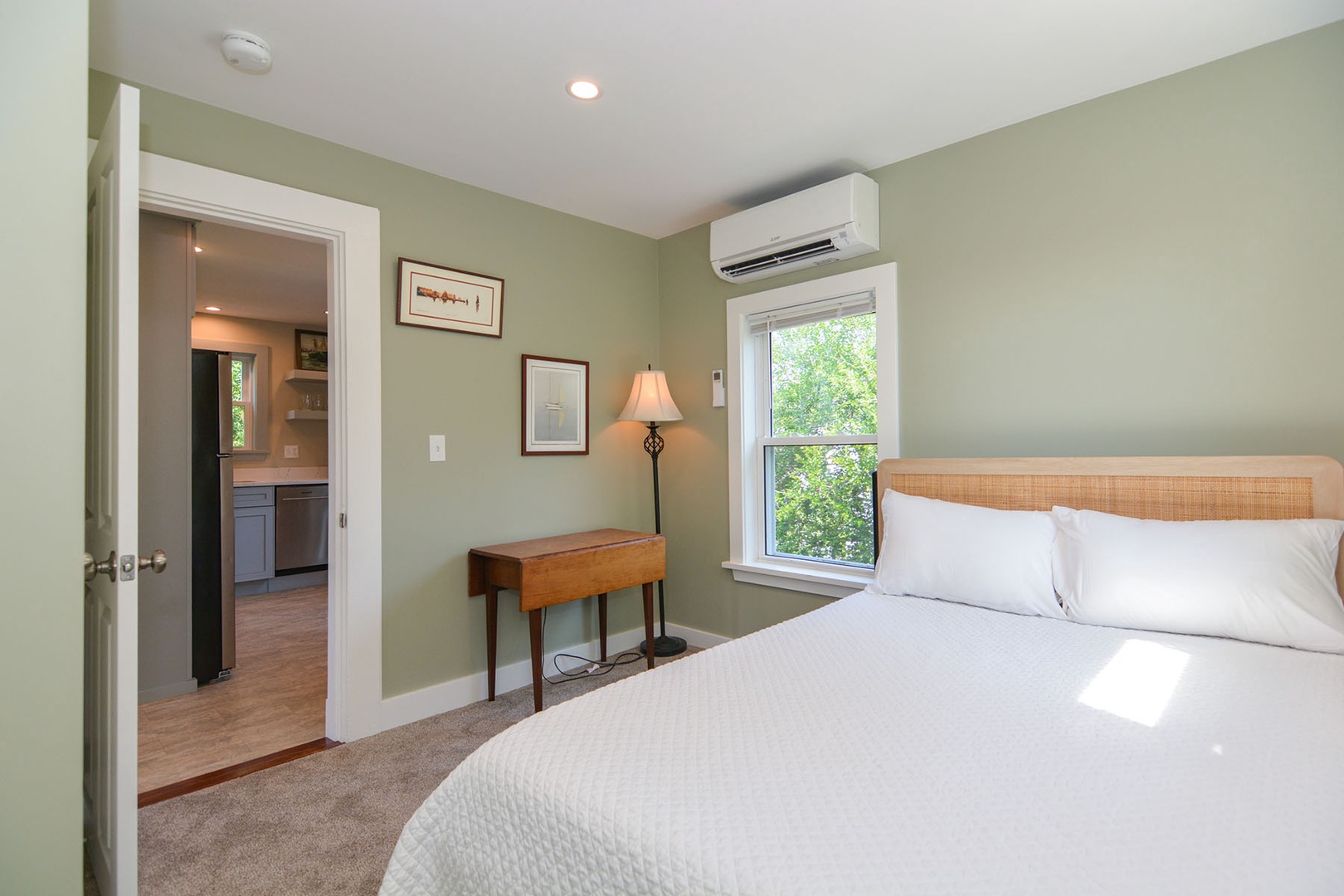 The primary bedroom with a Queen bed and AC.