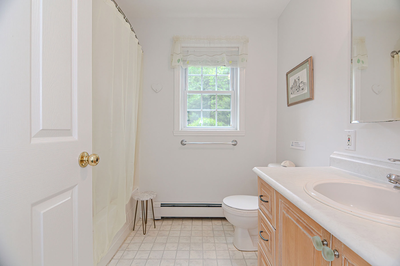 Full Bath across from the Den with walk in shower.