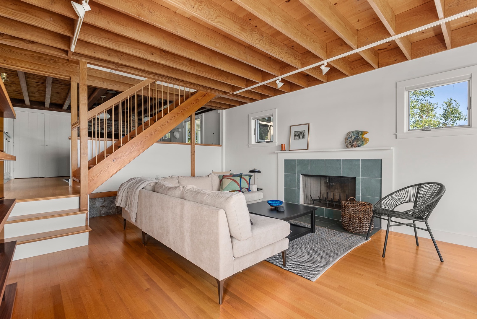 The living room includes an ornamental fireplace.