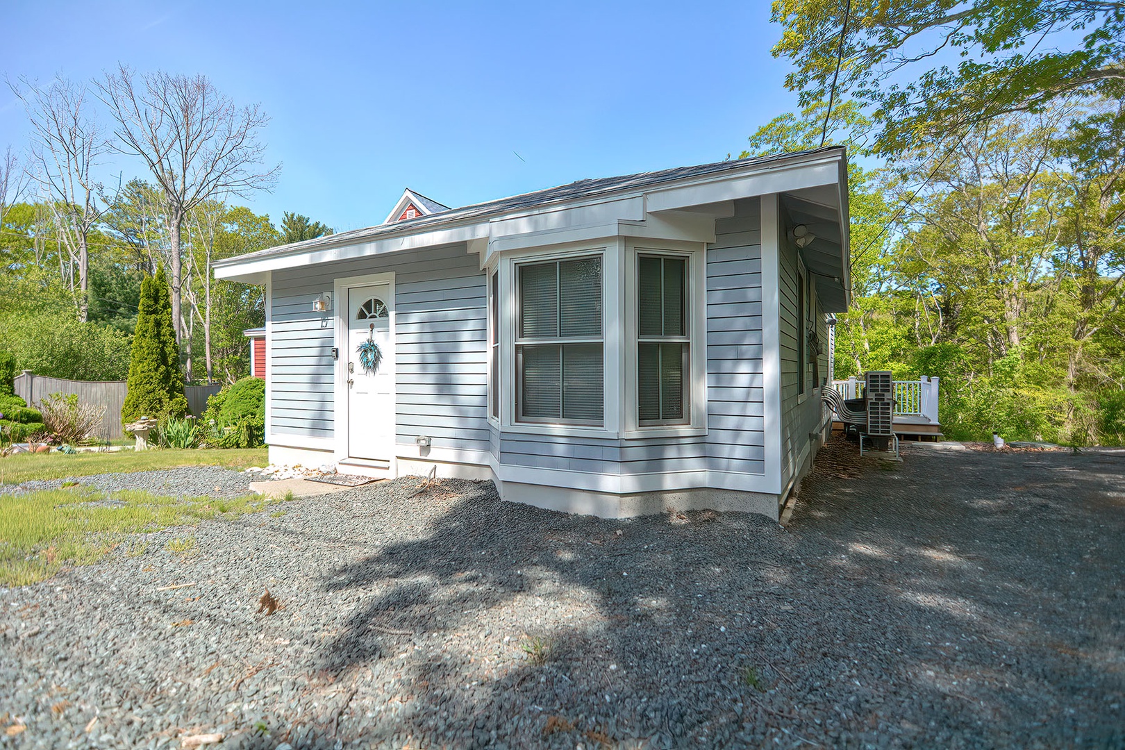 The front of the cottage and the gravel drive.