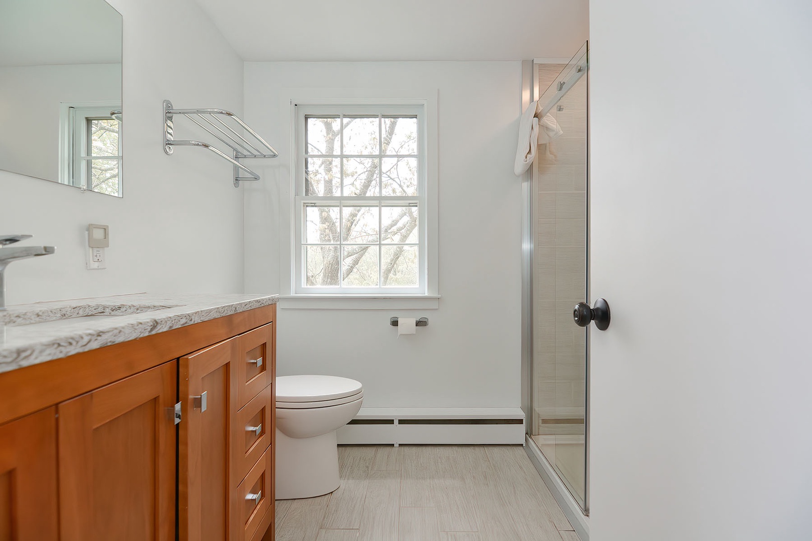 Full bathroom with walk-in shower.