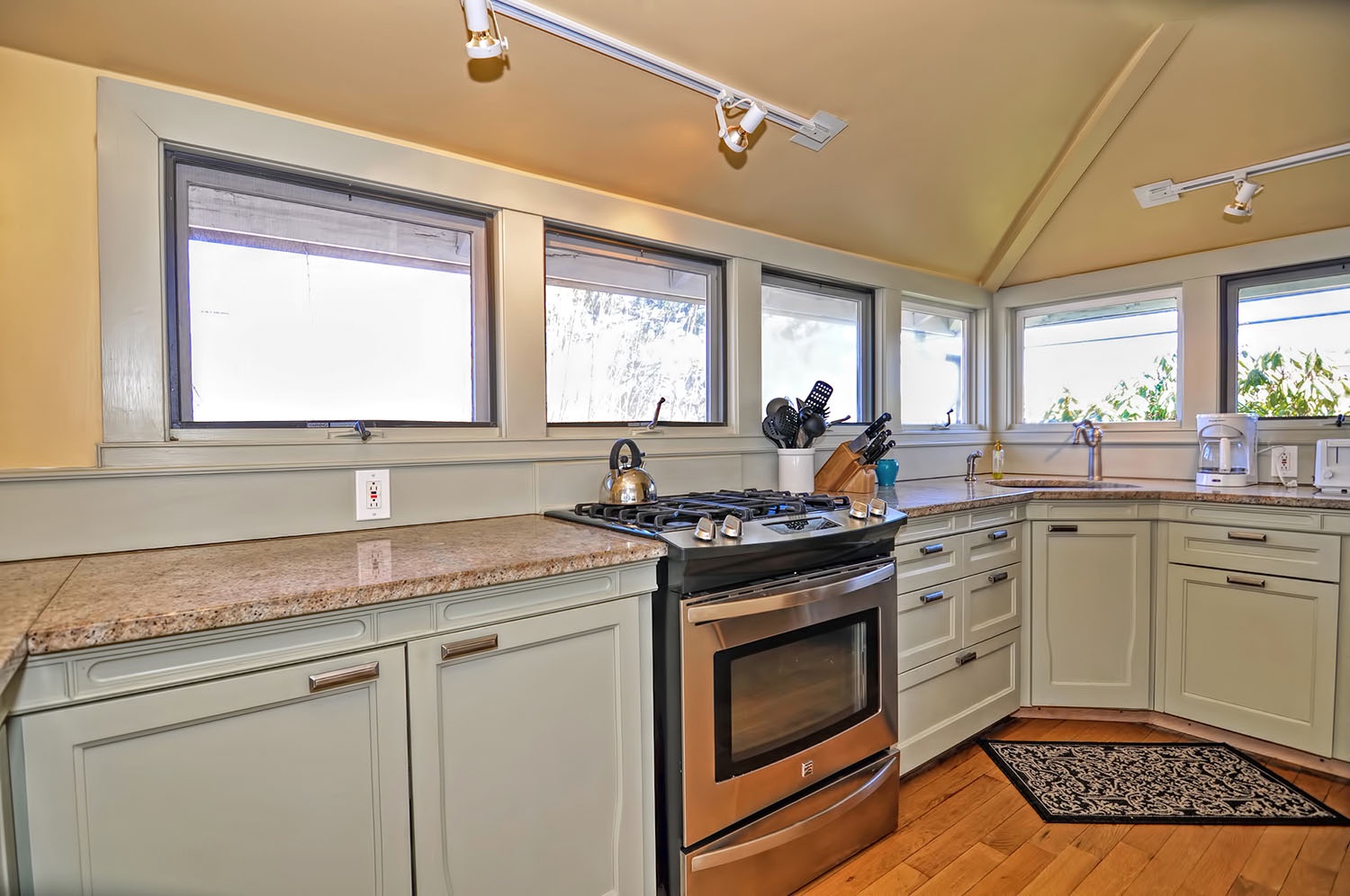 The windows in the kitchen let in lots of light.