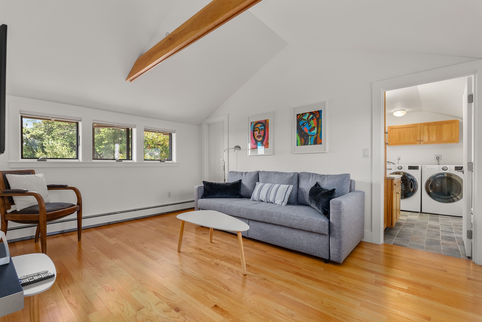 The sitting room on the second floor, along with a TV.