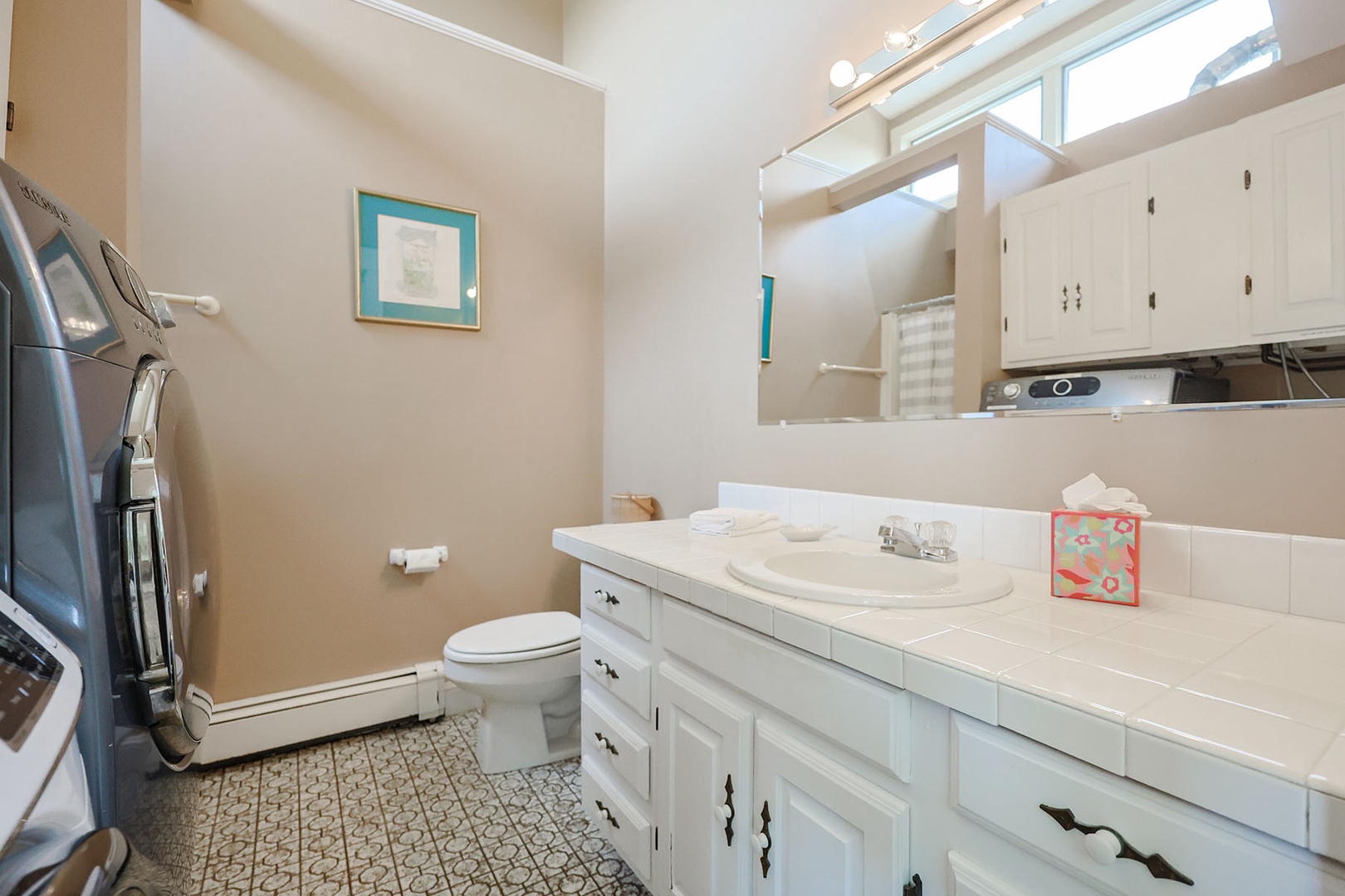 Ensuite bath has plenty of drawer and vanity space.