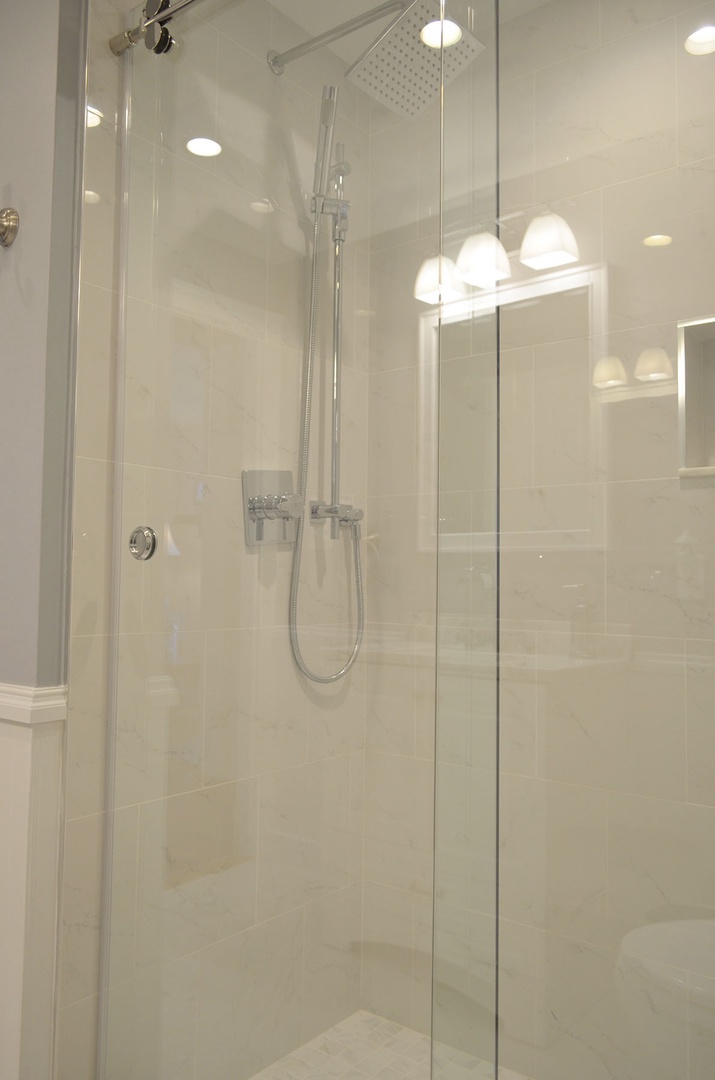 Rainfall shower head with a hand-held option.