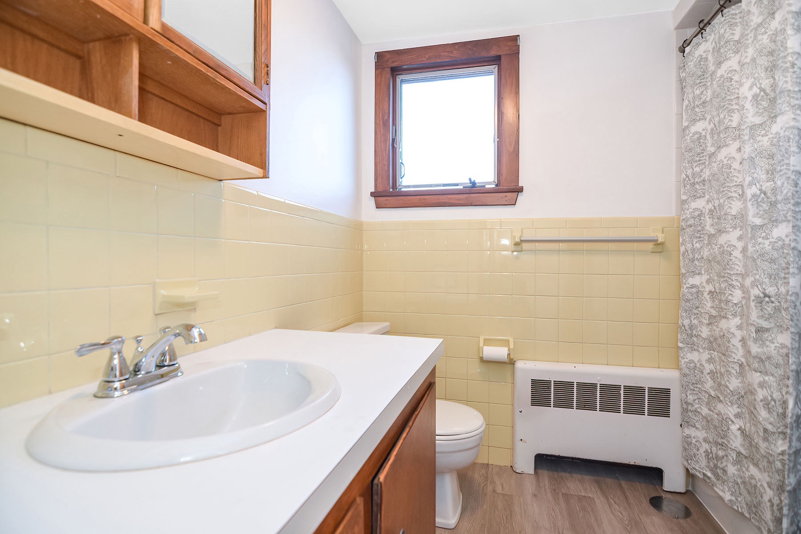 Shared full bath with tub/shower.