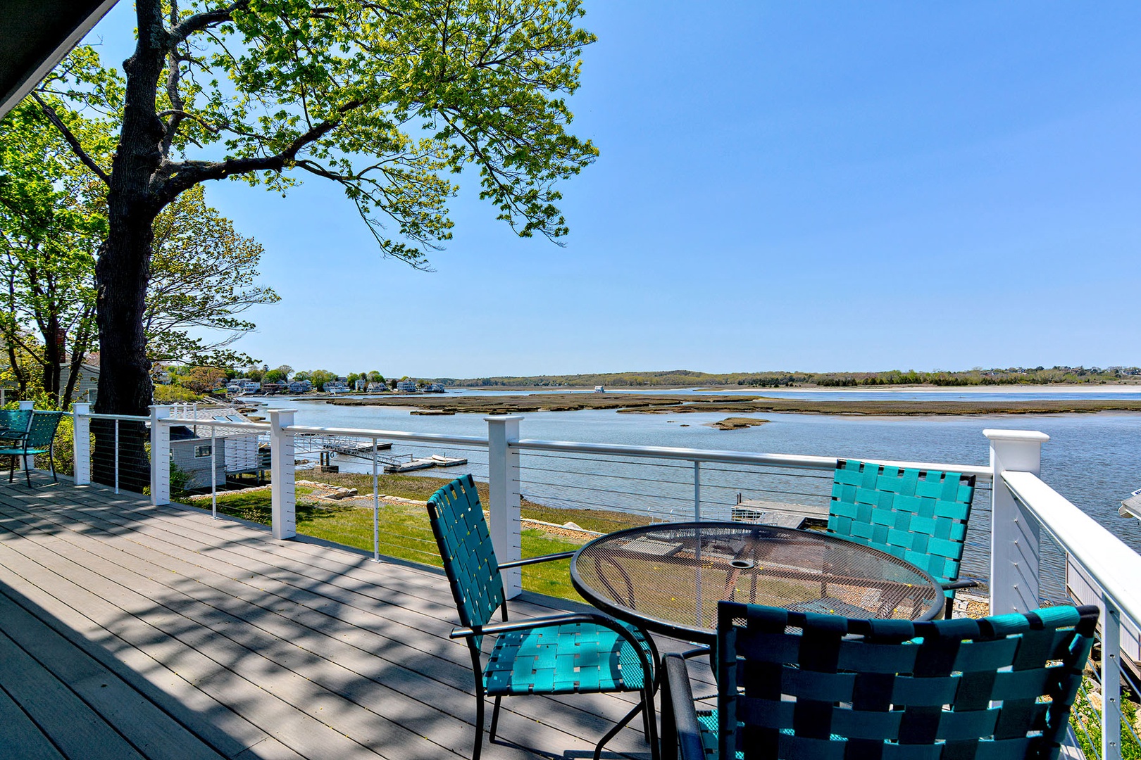The spacious deck overlooking the back yard and river.