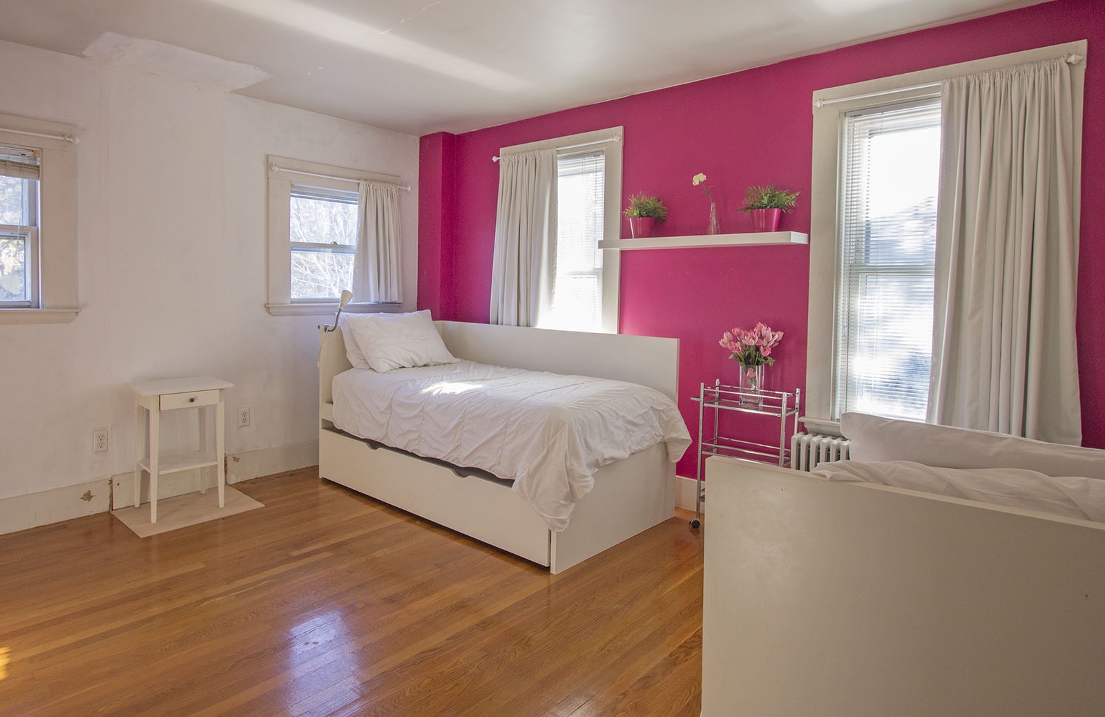 BR 3: A bright and sunny corner bedroom with twin beds.