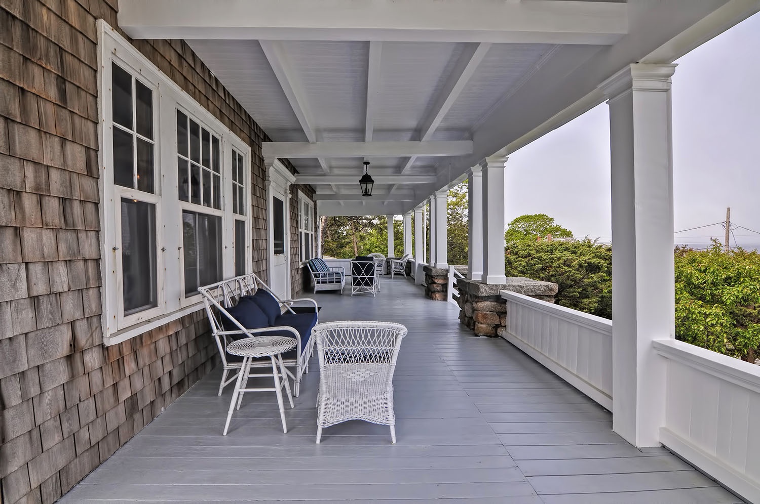 Exterior view of the large front porch with ocean views.