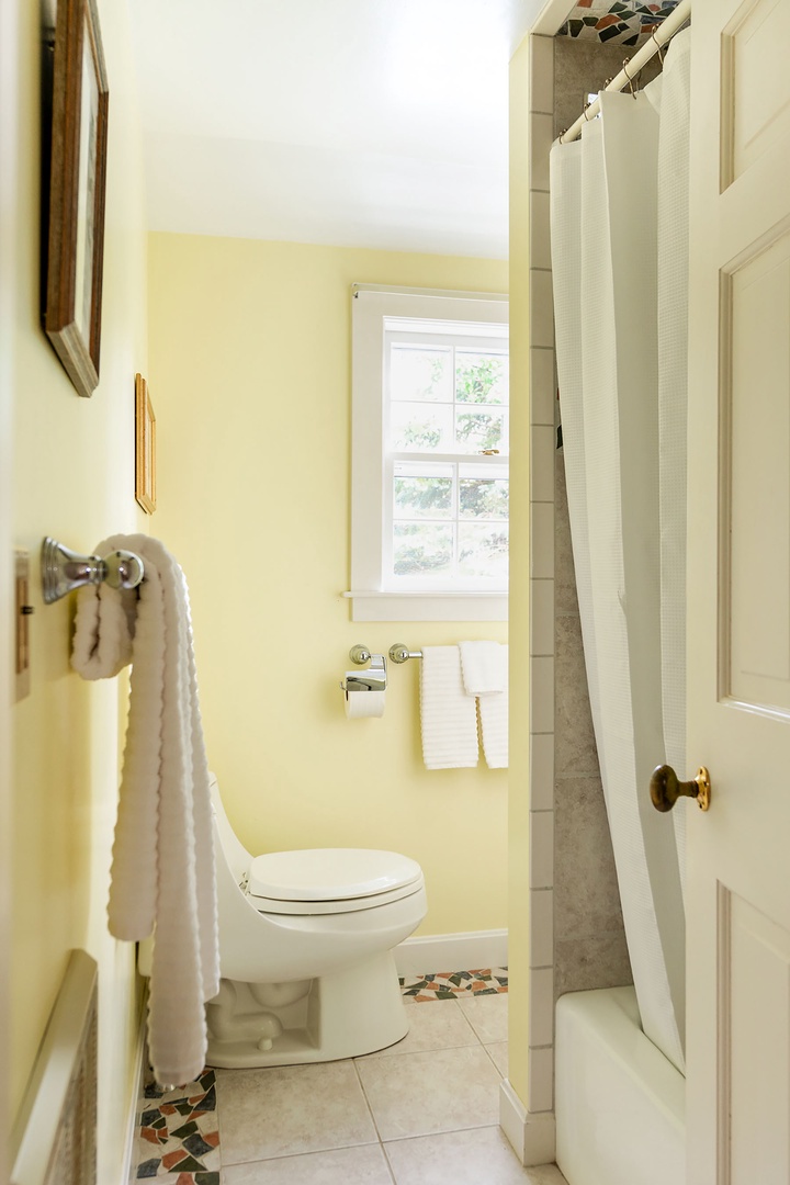 Full bathroom with tub/shower combo.