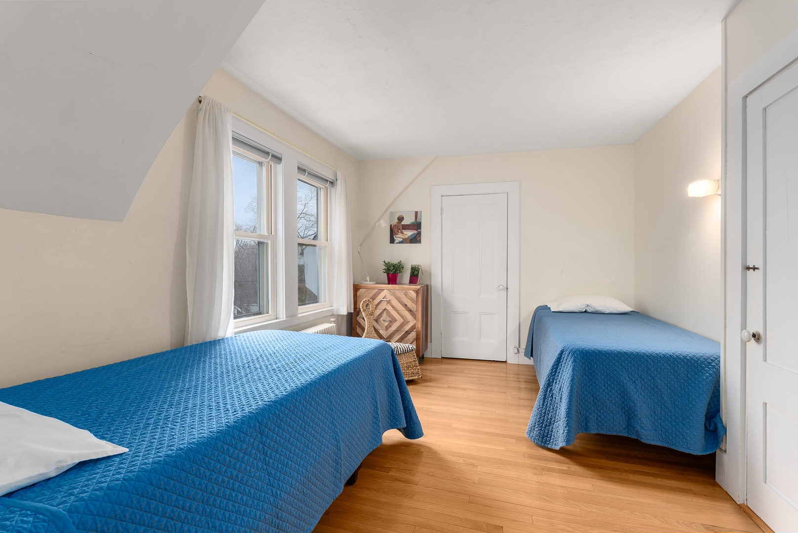 Bedroom 2: A sunny room with Twin beds.