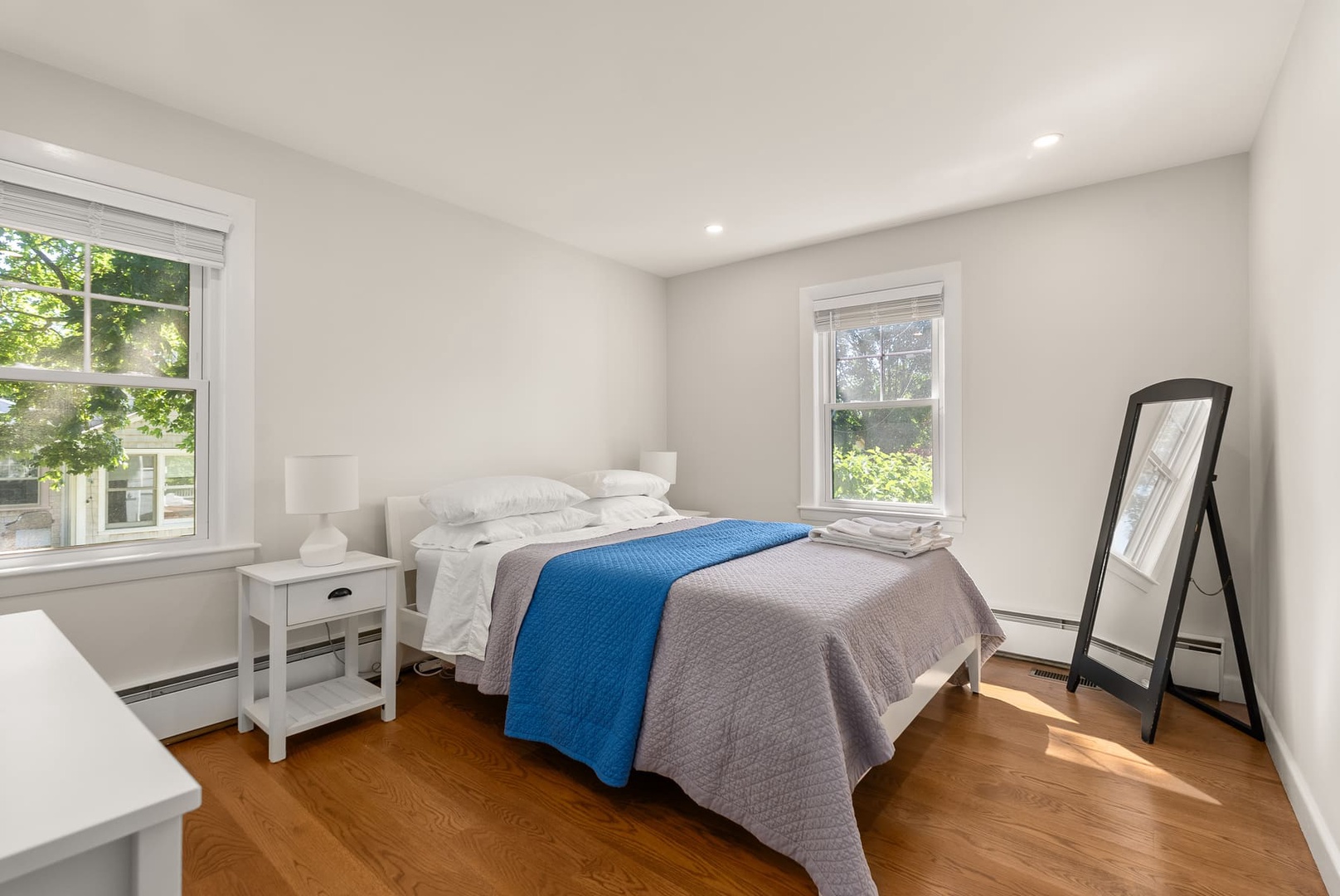 The primary bedroom with a queen bed on the ground floor.
