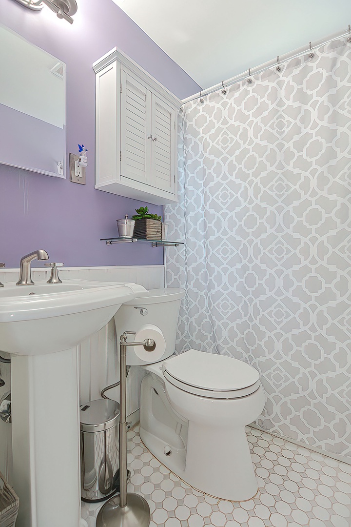 full bathroom with tub and shower.