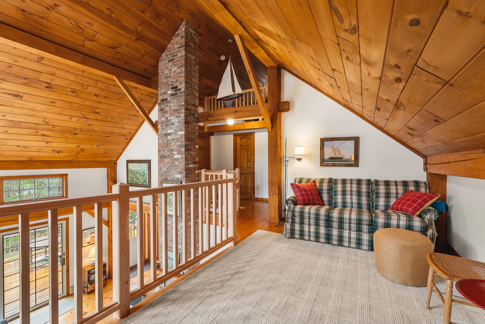 The TV area in the upper floor with comfortable seating.