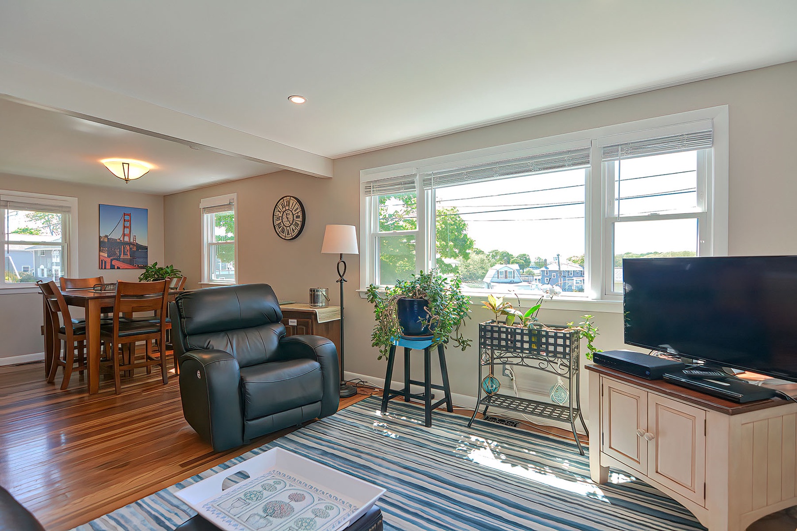 The open plan dining room/kitchen connects to the living area.