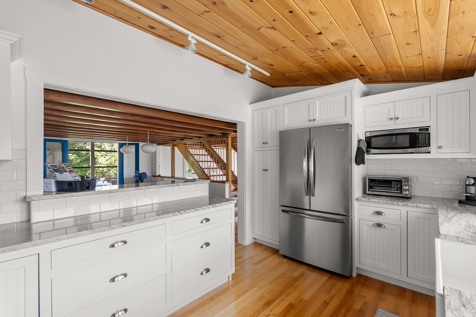 The kitchen has ample counter space and storage for meal prep.