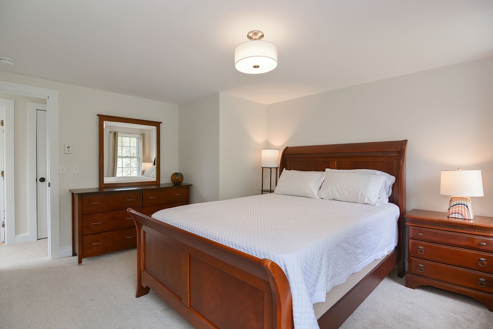 Bedroom 1: Primary bedroom with Queen bed.