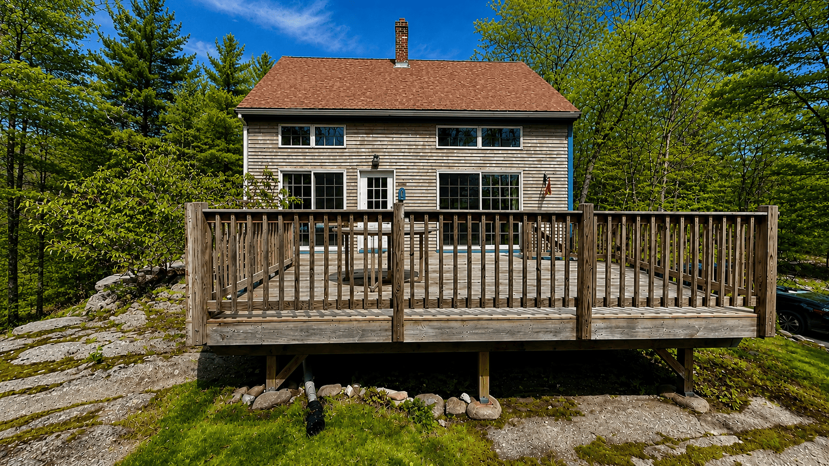 Front of House along with the deck.
