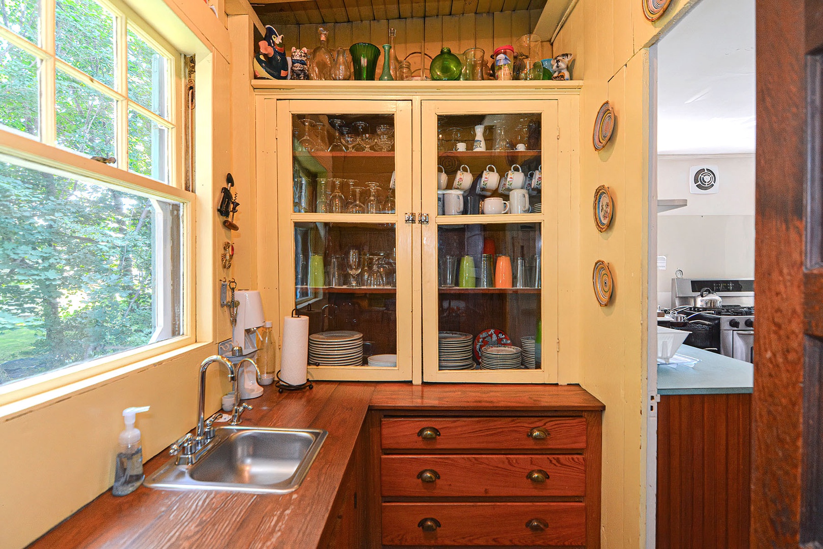 Fully stocked pantry with sink.