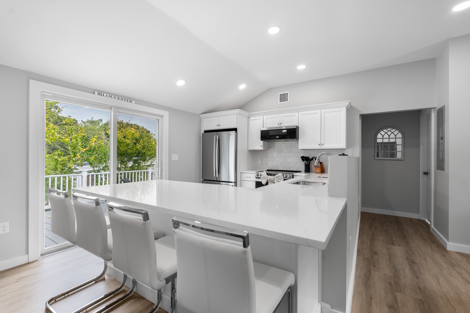 The eat-in kitchen seats up to four people.