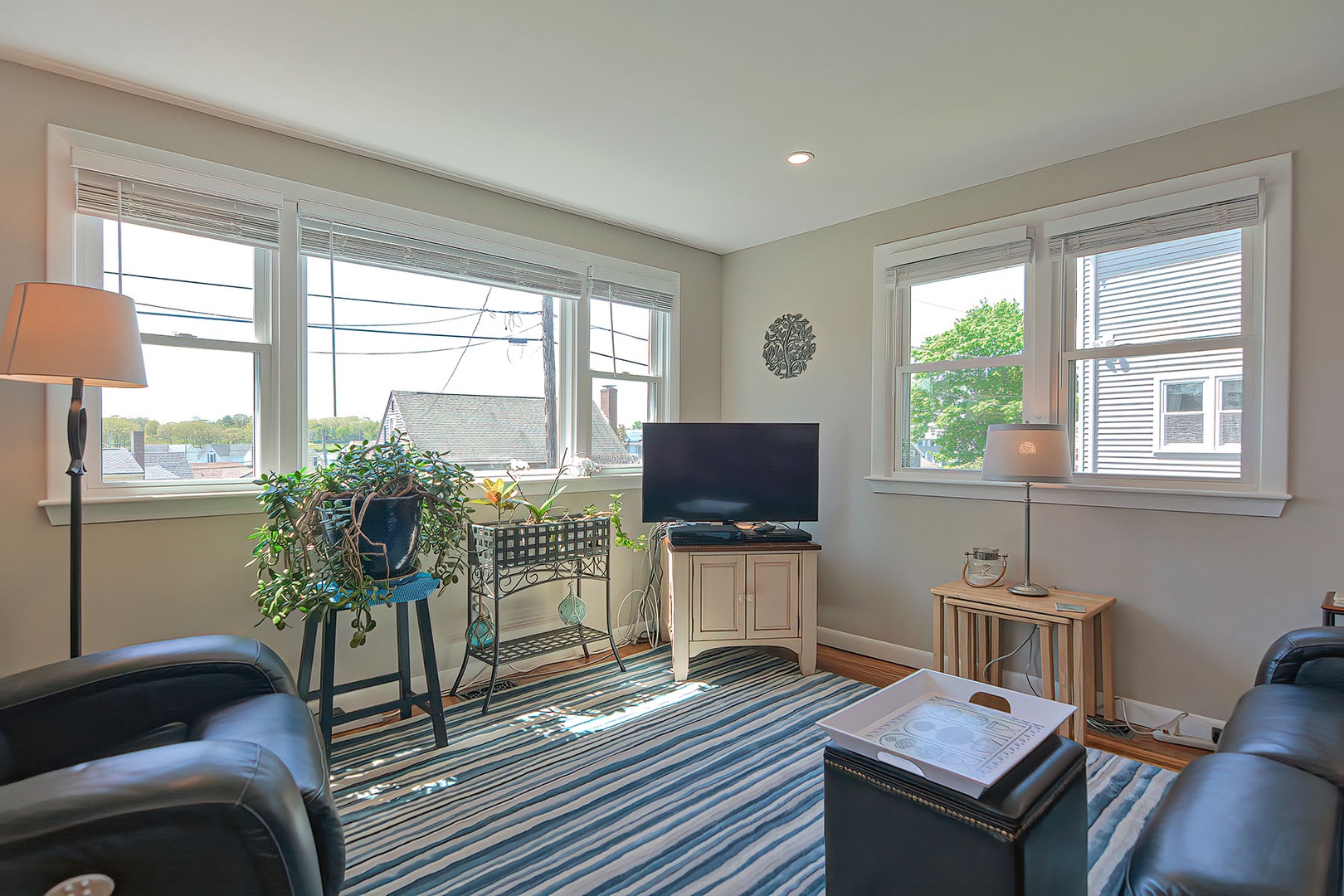 The comfortable living room has river views.