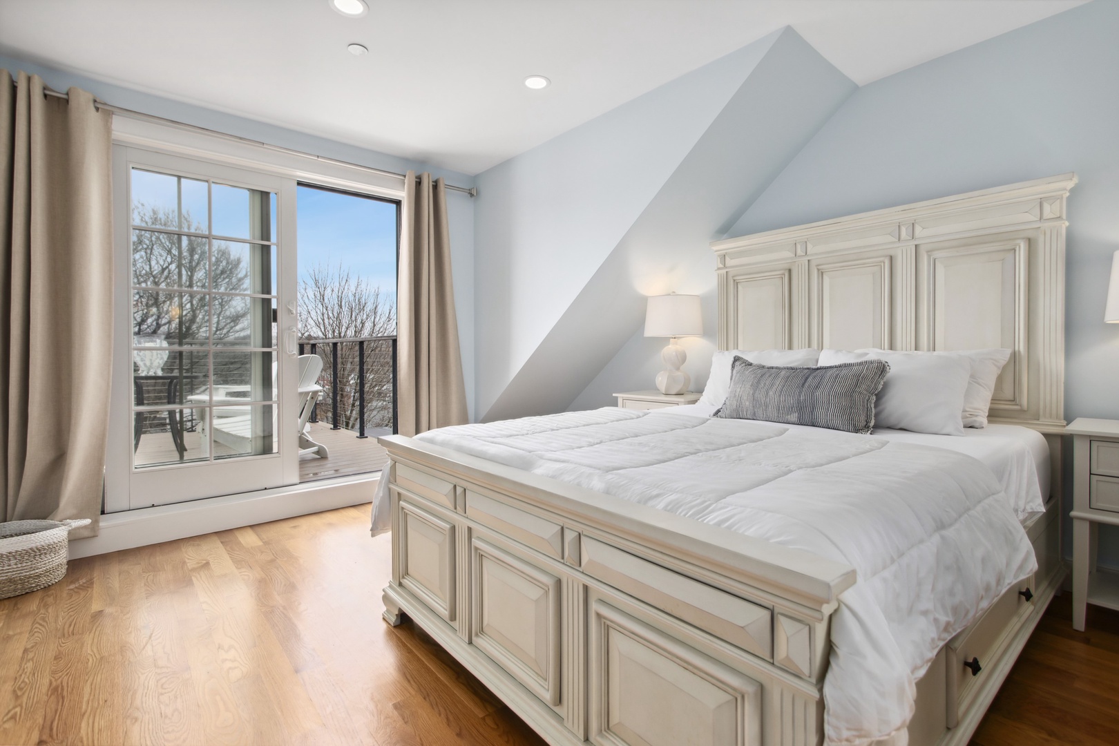 Primary queen bedroom with deck access.