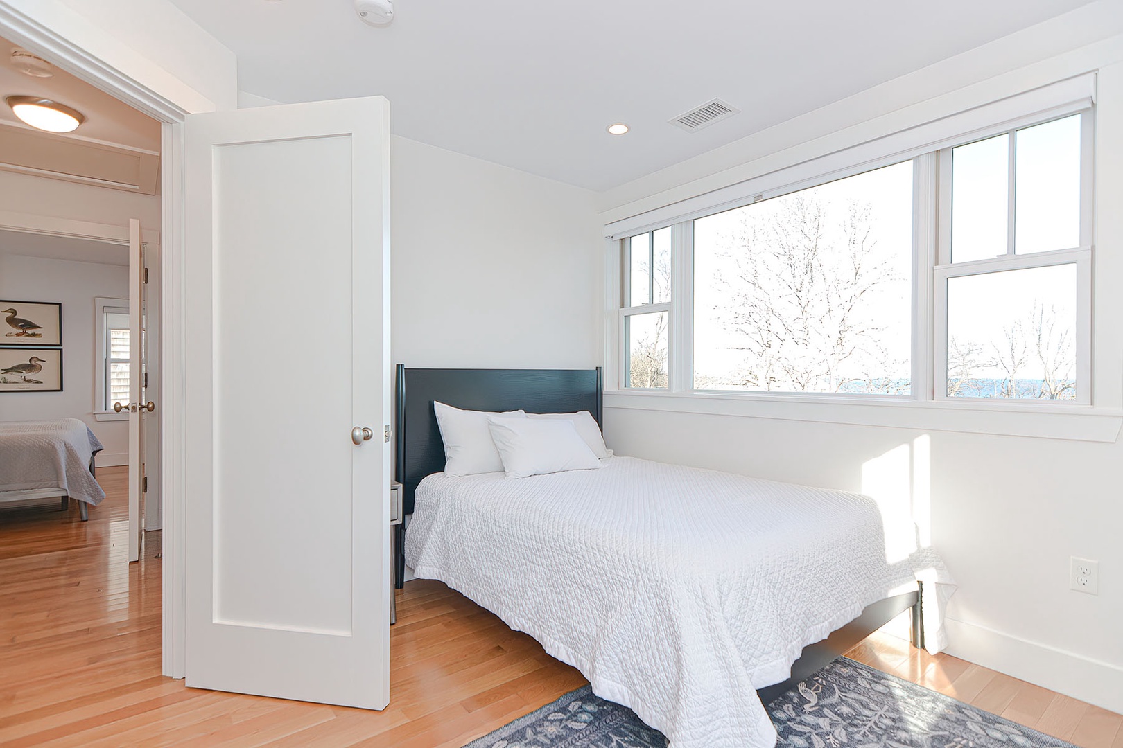 Bedroom 2 with water views from the window.