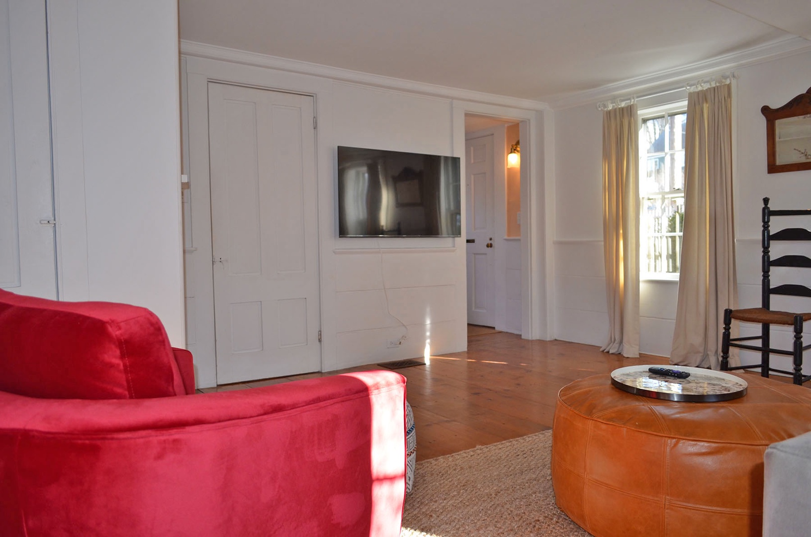 The Living Room with a mounted large screen TV.