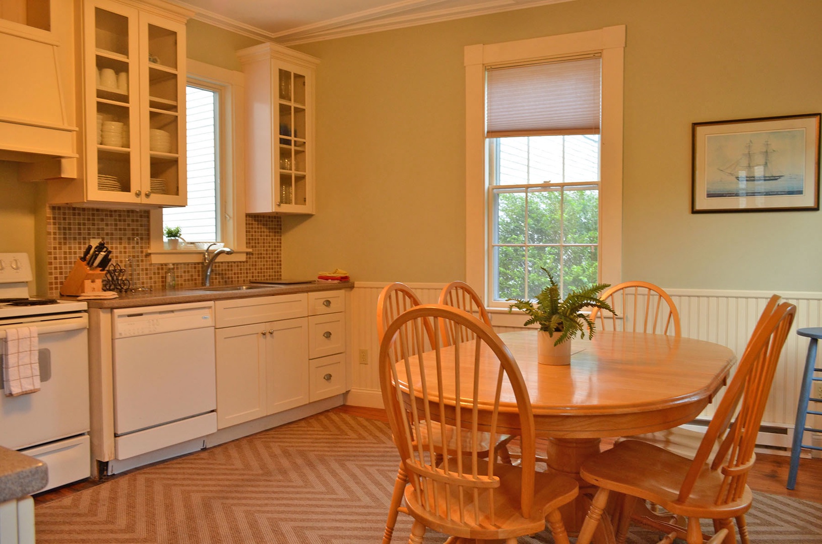 The eat-in kitchen with dining table.
