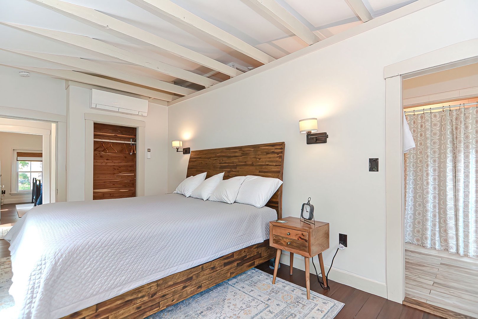Architectural details include the exposed wooden beams and a cedar closet..