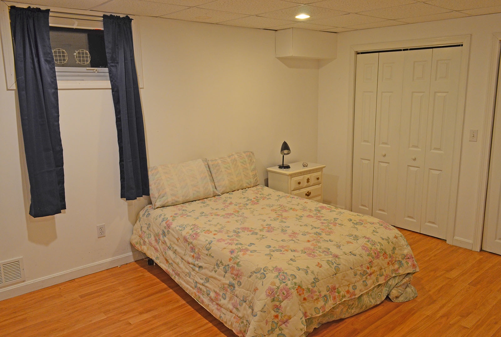 The spacious bedroom has a Full bed.