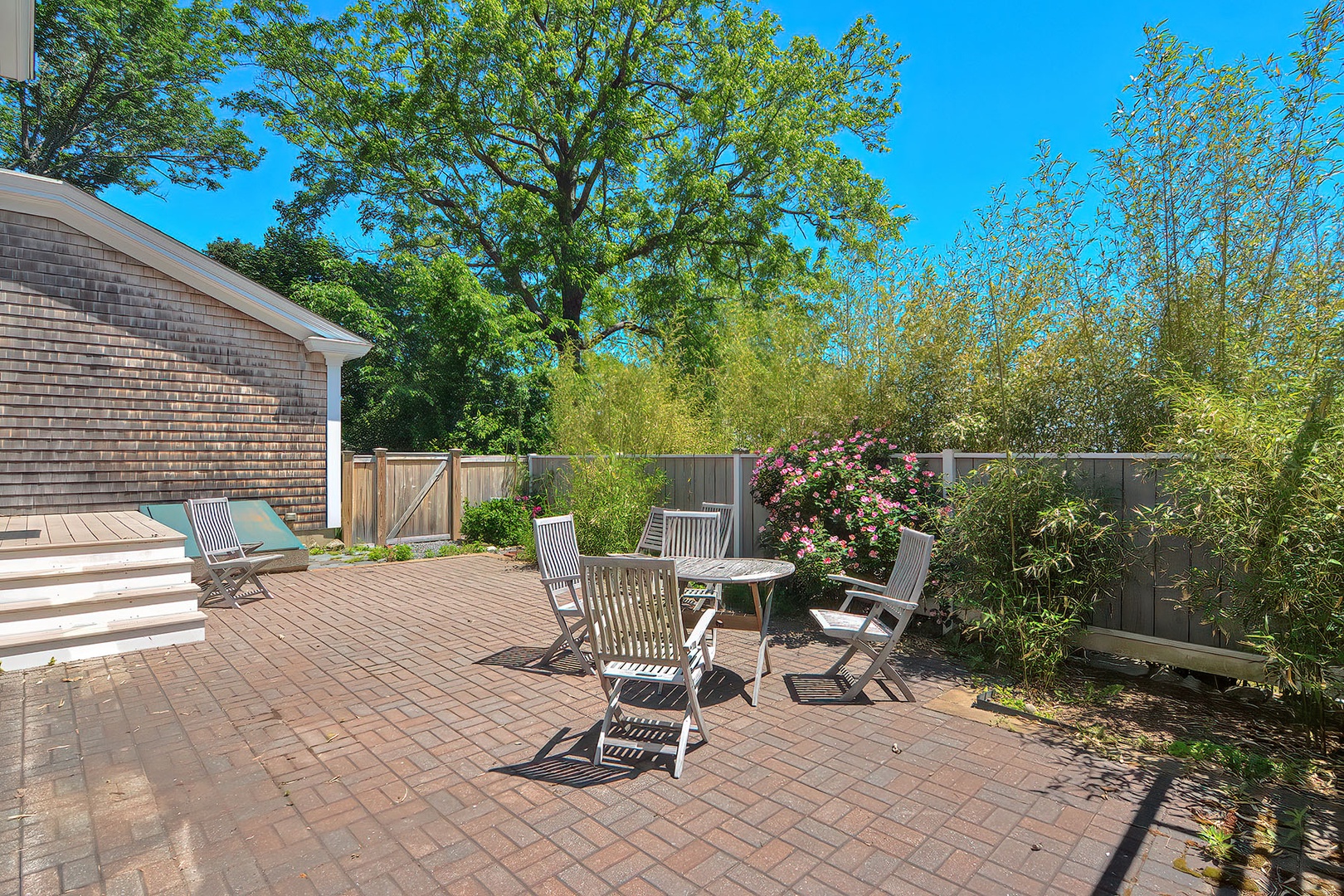 Greenery surrounds the patio which offers peek-a-boo ocean views..