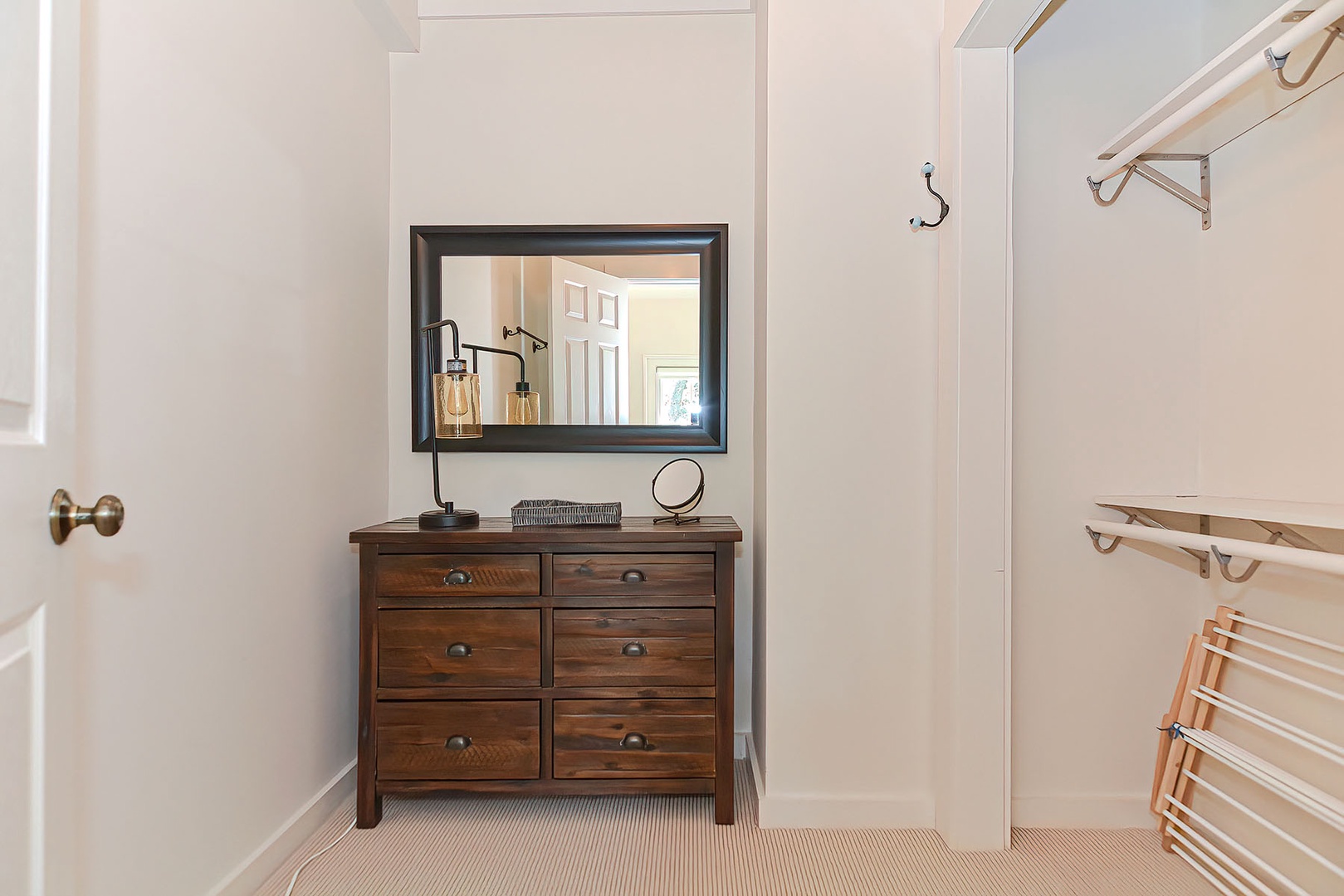 The walk in closet with dressing area.