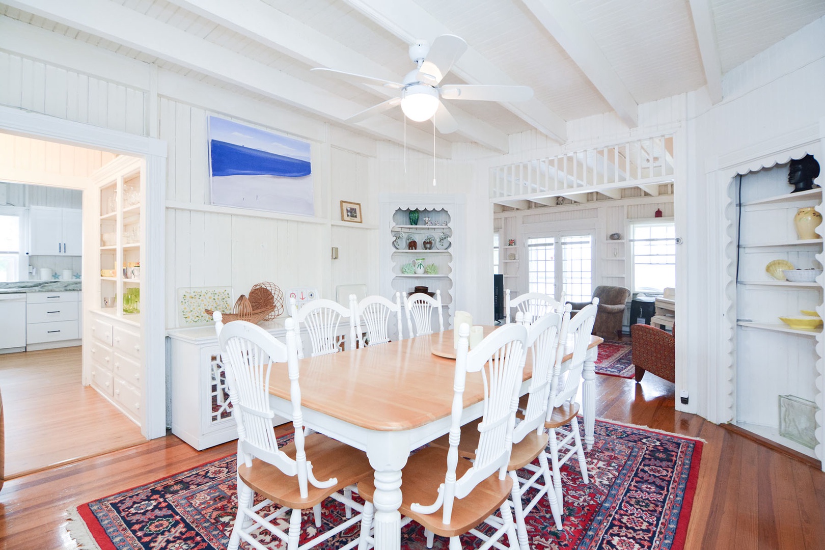 The dining room is connected to the kitchen and the living room.
