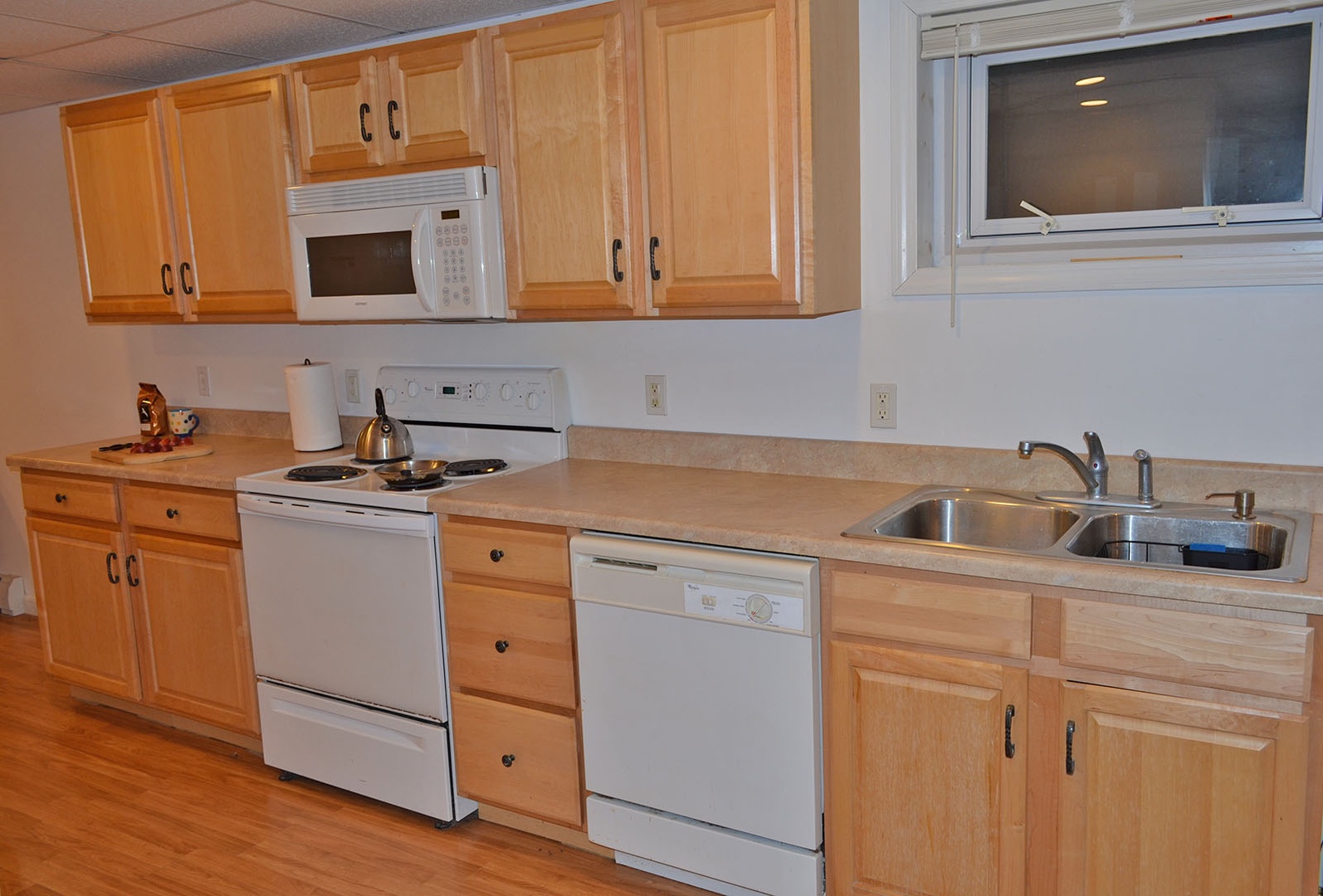 The kitchen has plenty of counter space for prep and storage.