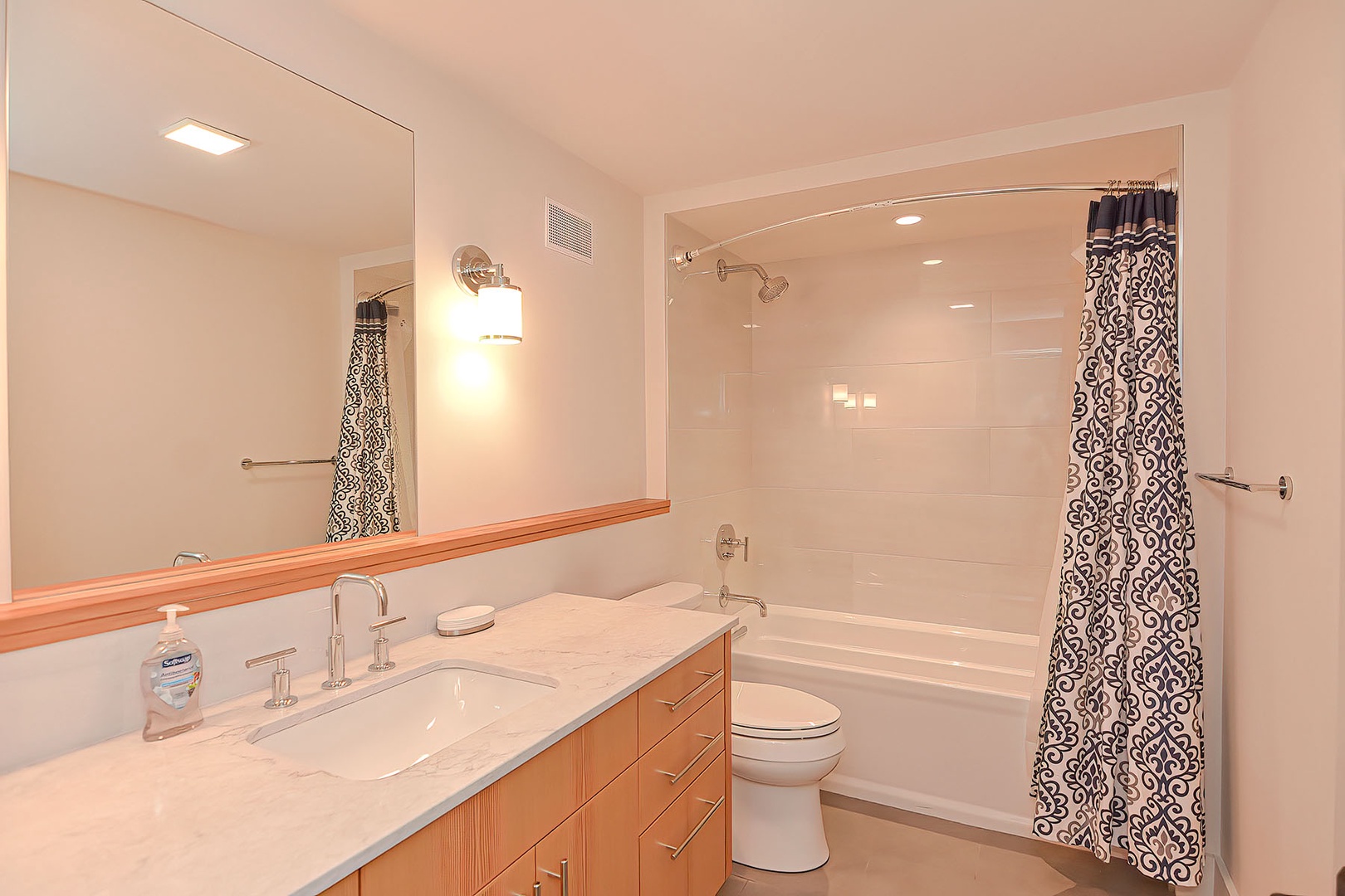 A full bath with a tub/shower combo is located on the lower level.