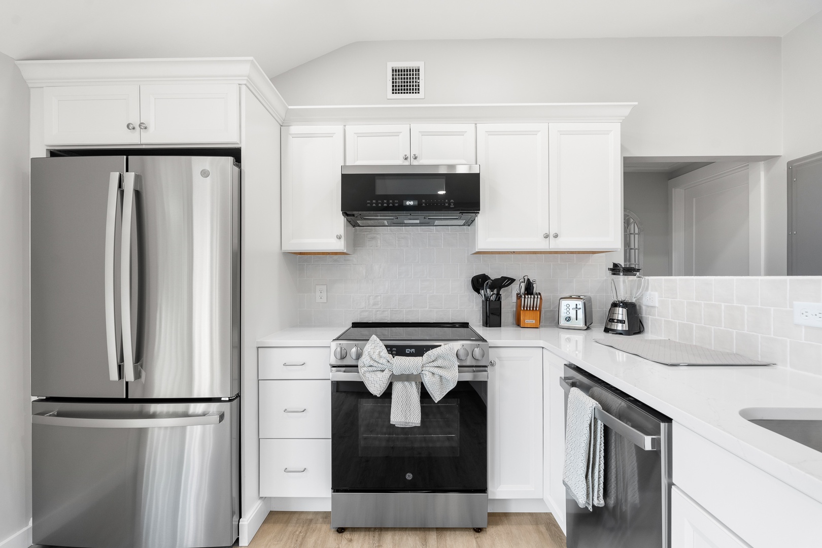 The kitchen comes with sleek, modern appliances for all your cooking needs.