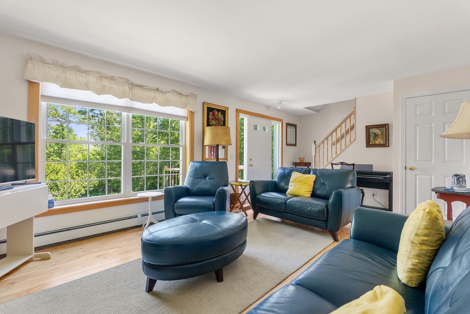 Living room with leather sofas and fireplace.