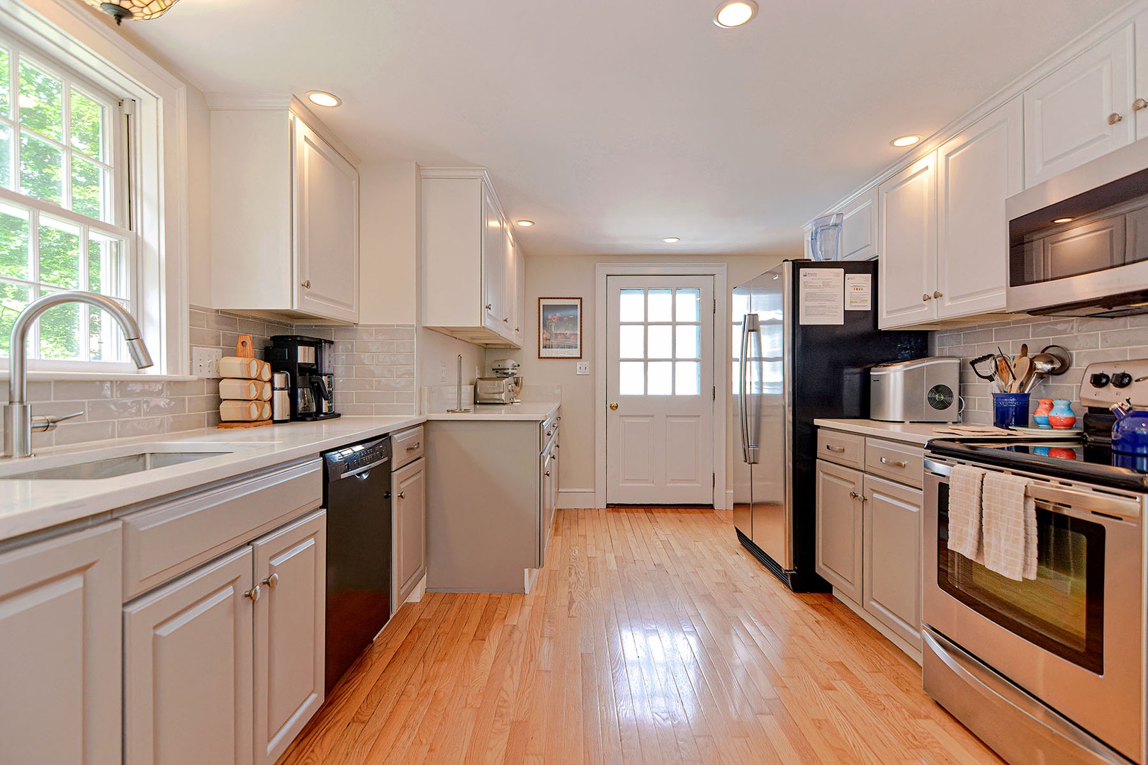 The stainless steel appliances of the kitchen.