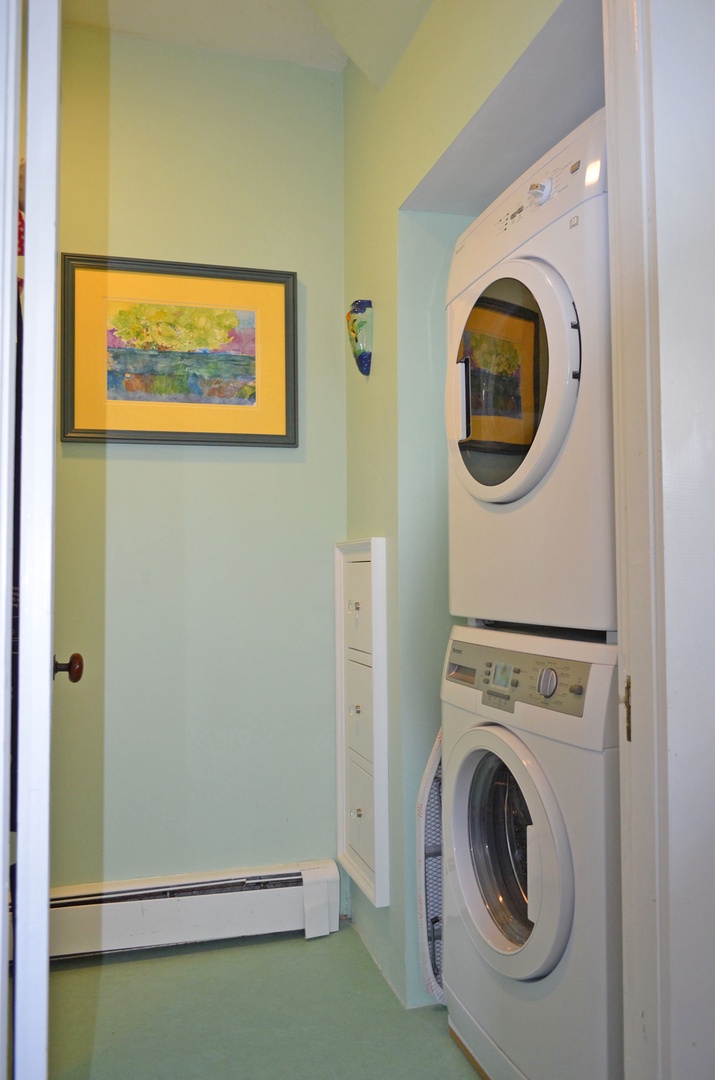 The laundry unit is located in the half bath.