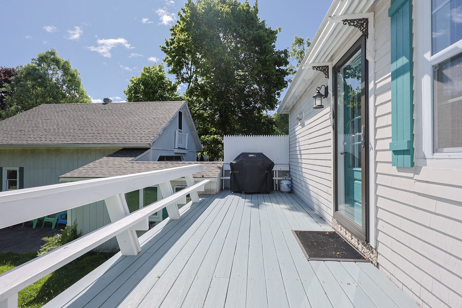 The grill area is also located on the deck.
