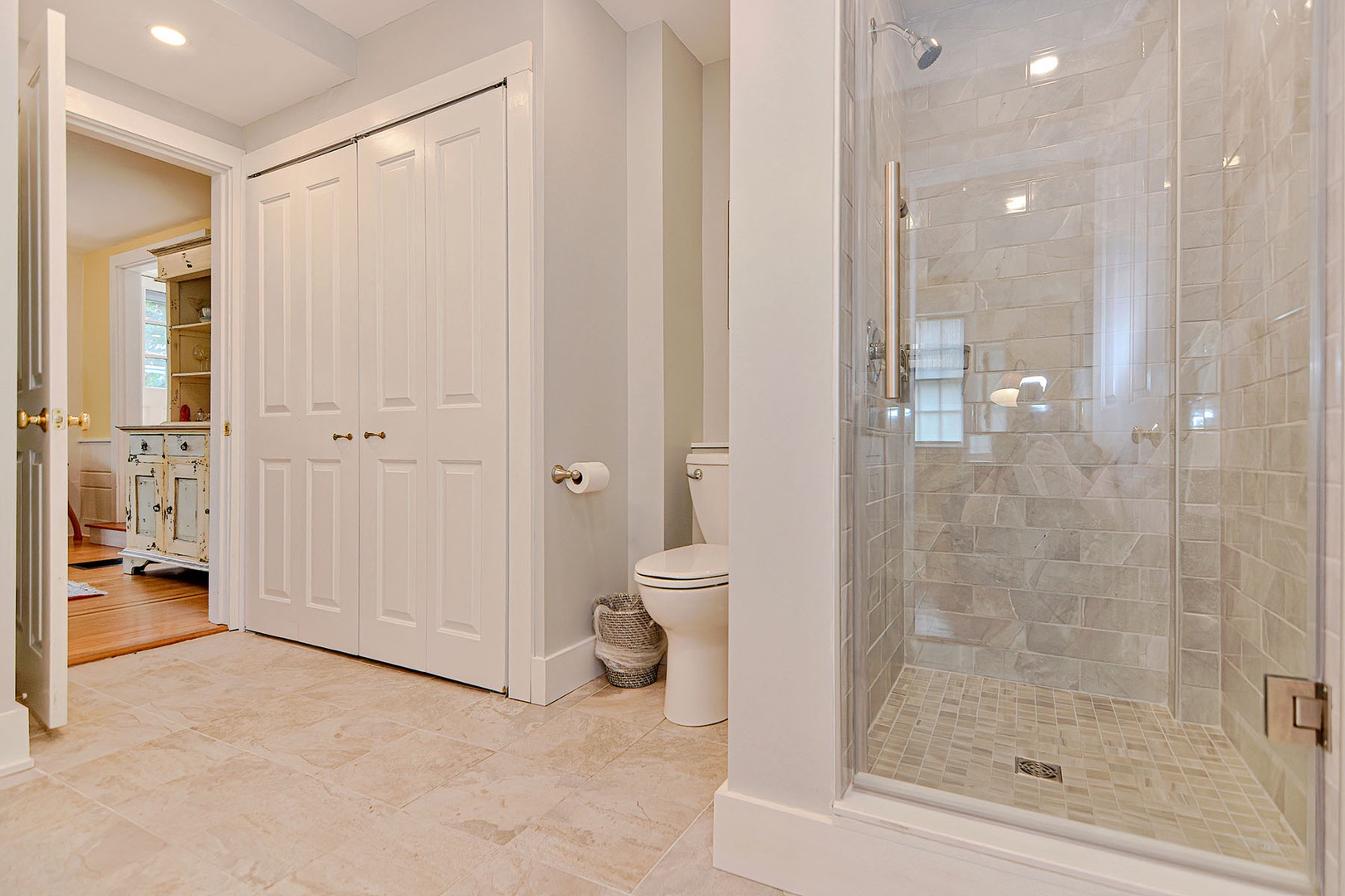 Full bath with tiled walk-in shower.