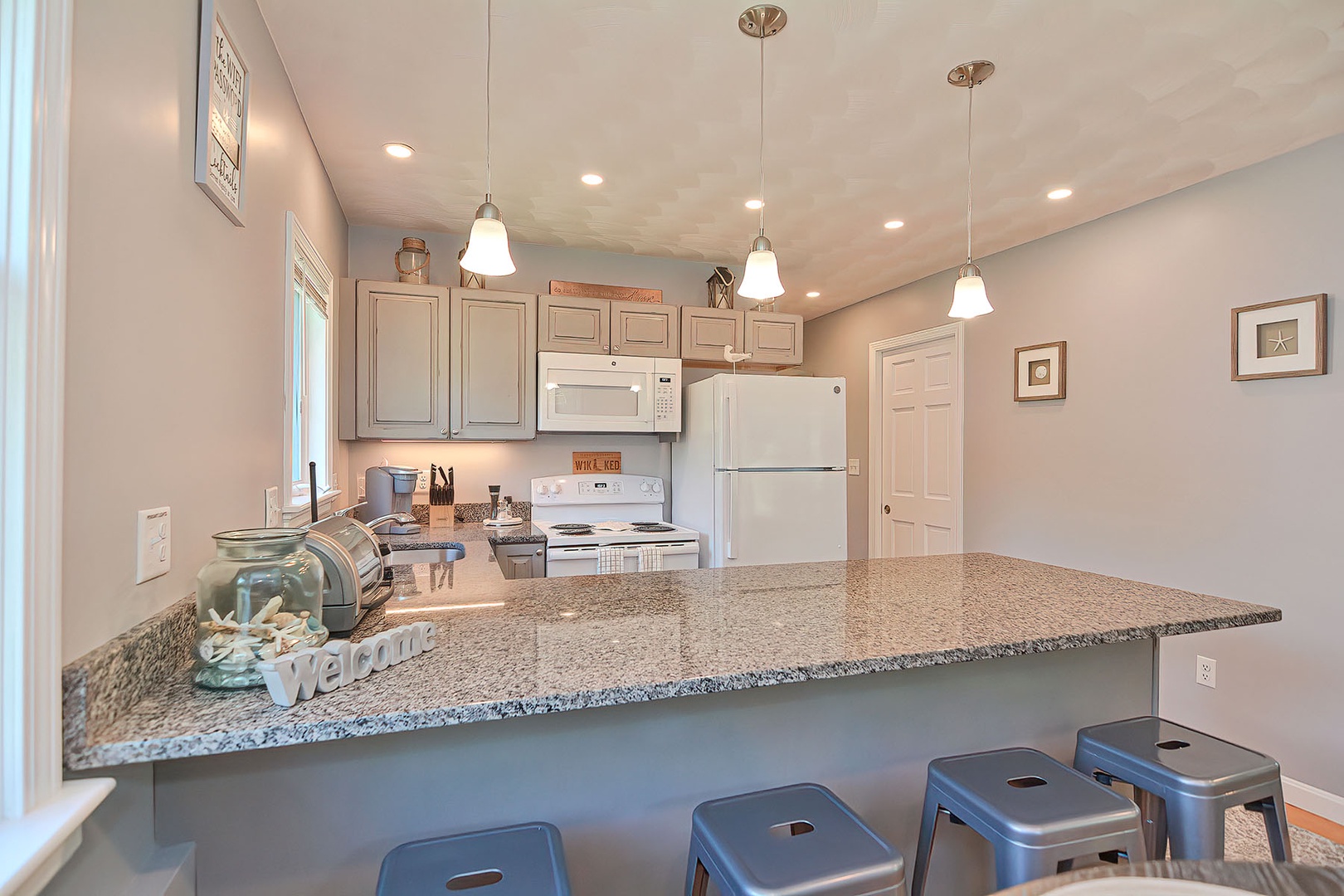 The breakfast bar adds additional dining or meal prep space.