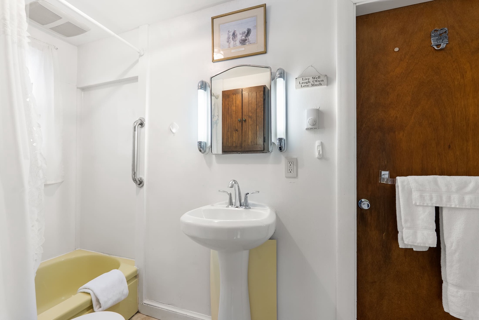 Full bathroom with tub/shower combo.