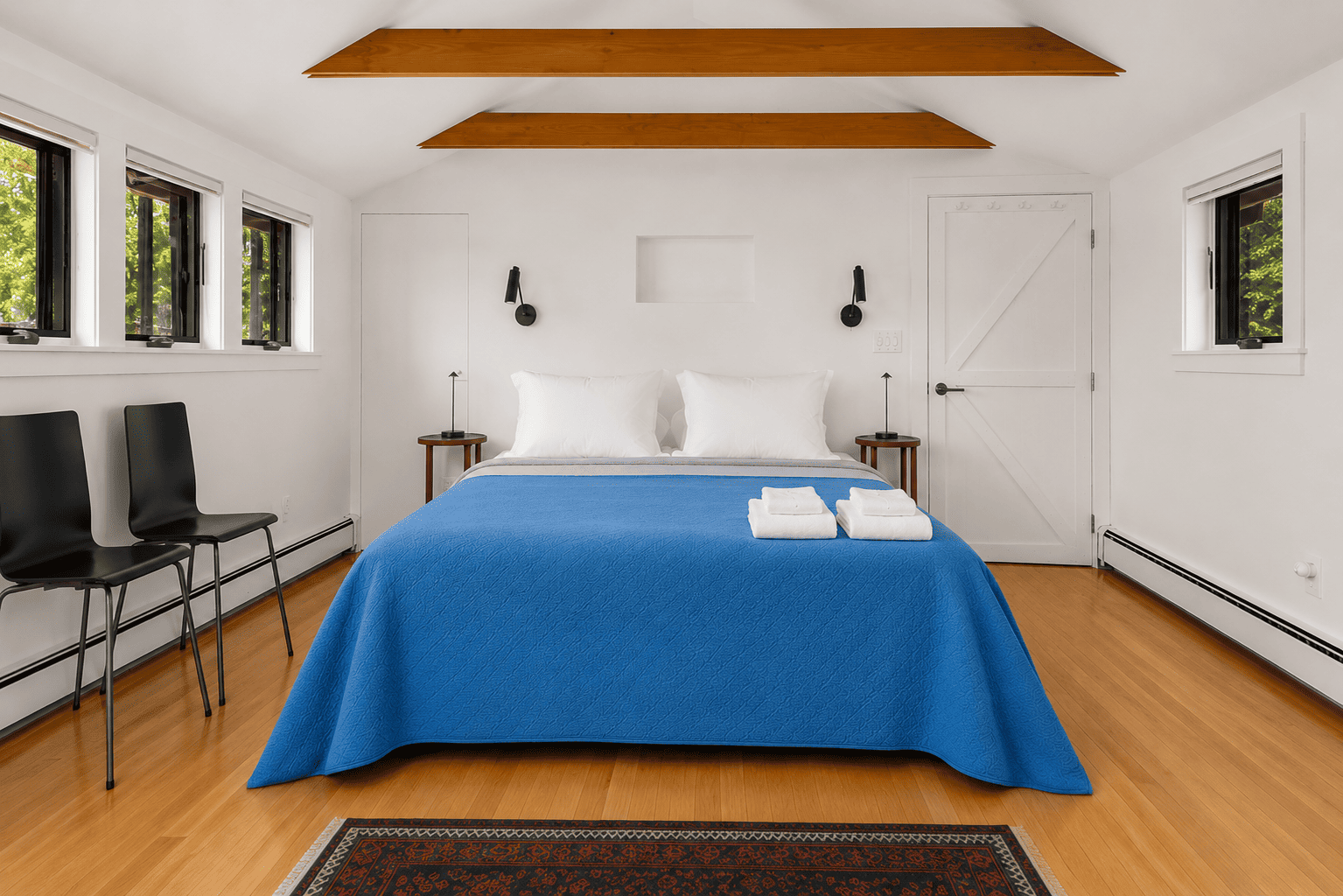 Primary bedroom with a king bed, balcony, and amazing ocean views.